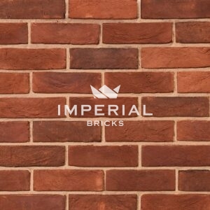 Capital Blend Soft Red bricks shown in a wall. The bricks are red with a blend of some darker faces.