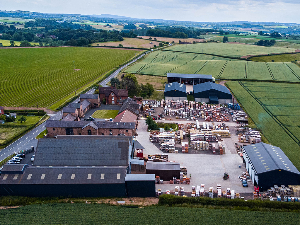 Aerial view of Imperial Bricks' premises taken in 2021, showing barn style office buildings, warehouse units and brick storage area surrounded by farmers fields.