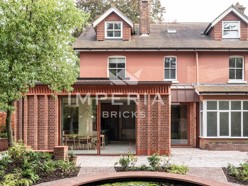 Rear view Cast Corbel House built out of Soft Red handmade bricks