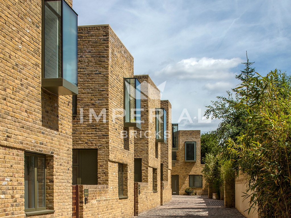 Angled view of a development in London, built using Reclamation Yellow Stock handmade bricks.